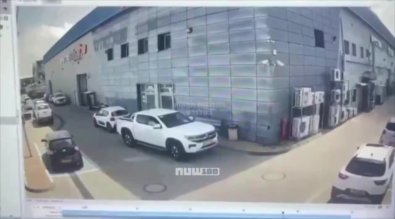 Video shows the moment when cluster submunitions from an Iranian missile struck a commercial area in Petah Tikva, Israel