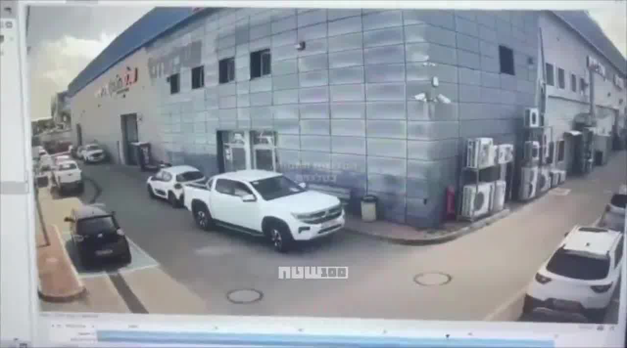 Video shows the moment when cluster submunitions from an Iranian missile struck a commercial area in Petah Tikva, Israel