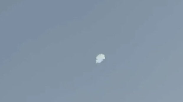 Explosions, likely resulting from successful interceptions by air defenses, heard in the sky to the northwest of Kuwait City