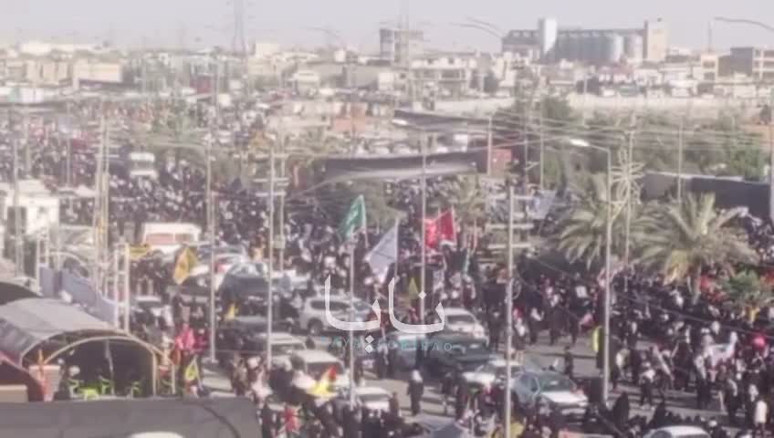 Huge crowds of mourners are waiting for the coffin in the holy city of Karbala.