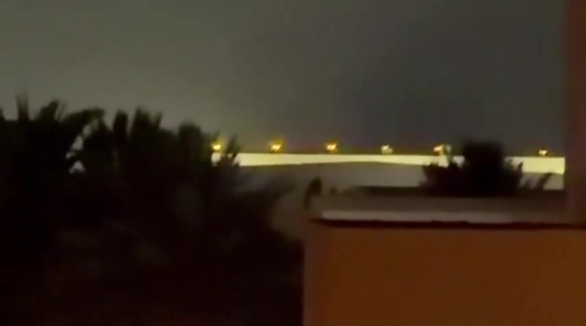 Iran's IRGC is launching a large-scale ballistic missile and drone attack on Kuwait and Bahrain in response to today's U.S. strikes on Iran. Reports indicate direct impacts on the U.S. Navy's 5th Fleet HQ in Bahrain, with footage showing plumes of smoke rising from the area