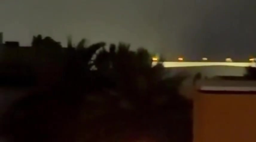 Iran's IRGC is launching a large-scale ballistic missile and drone attack on Kuwait and Bahrain in response to today's U.S. strikes on Iran. Reports indicate direct impacts on the U.S. Navy's 5th Fleet HQ in Bahrain, with footage showing plumes of smoke rising from the area
