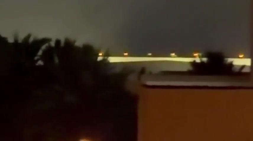Iran's IRGC is launching a large-scale ballistic missile and drone attack on Kuwait and Bahrain in response to today's U.S. strikes on Iran. Reports indicate direct impacts on the U.S. Navy's 5th Fleet HQ in Bahrain, with footage showing plumes of smoke rising from the area