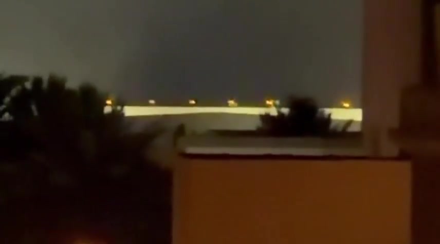 Iran's IRGC is launching a large-scale ballistic missile and drone attack on Kuwait and Bahrain in response to today's U.S. strikes on Iran. Reports indicate direct impacts on the U.S. Navy's 5th Fleet HQ in Bahrain, with footage showing plumes of smoke rising from the area