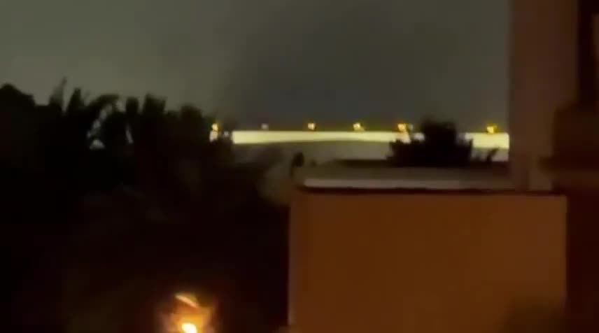 Iran's IRGC is launching a large-scale ballistic missile and drone attack on Kuwait and Bahrain in response to today's U.S. strikes on Iran. Reports indicate direct impacts on the U.S. Navy's 5th Fleet HQ in Bahrain, with footage showing plumes of smoke rising from the area