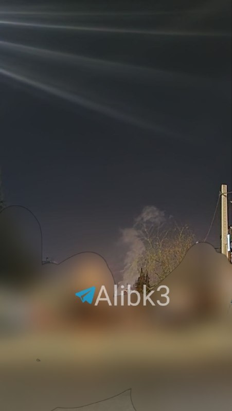 Smoke plumes rose over Yasuj, Iran; the cause—whether Iranian missiles were launched or an airstrike—is unclear.