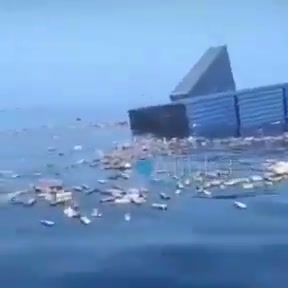 Unverified footage of a container ship sinking and containers floating afterward